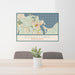 24x36 Edgartown Massachusetts Map Print Lanscape Orientation in Woodblock Style Behind 2 Chairs Table and Potted Plant