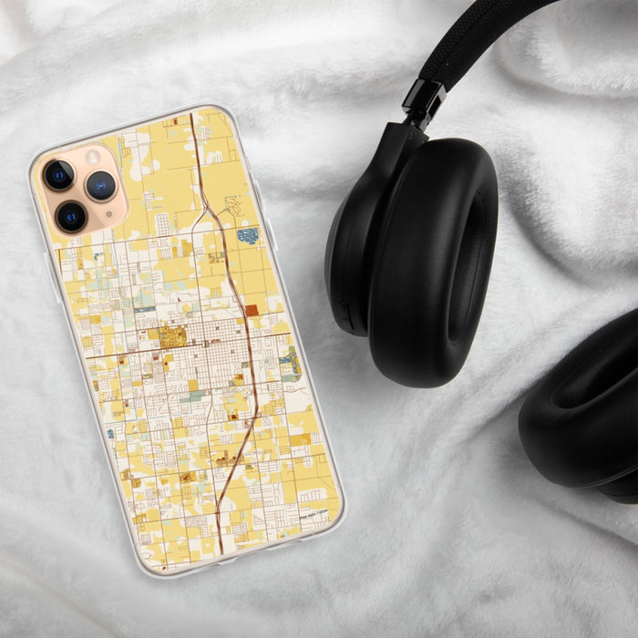 Custom Edinburg Texas Map Phone Case in Woodblock on Table with Black Headphones