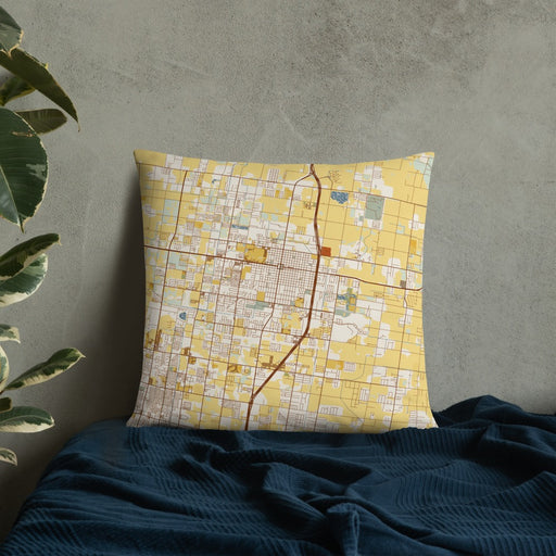 Custom Edinburg Texas Map Throw Pillow in Woodblock on Bedding Against Wall