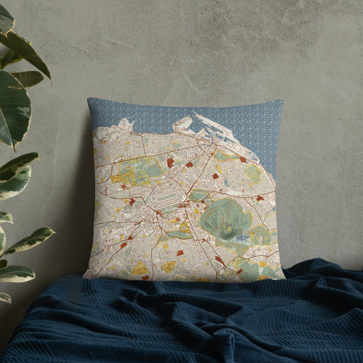 Custom Edinburgh Scotland Map Throw Pillow in Woodblock on Bedding Against Wall