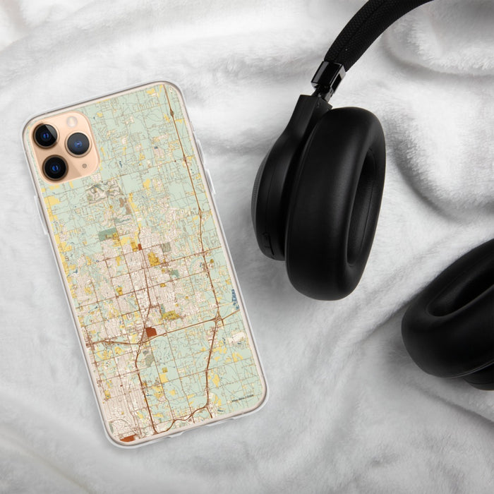 Custom Edmond Oklahoma Map Phone Case in Woodblock on Table with Black Headphones