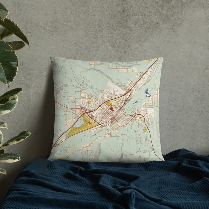 Custom Elko Nevada Map Throw Pillow in Woodblock on Bedding Against Wall