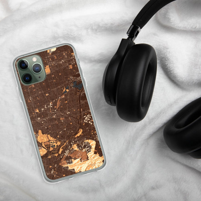 Custom El Monte California Map Phone Case in Ember on Table with Black Headphones