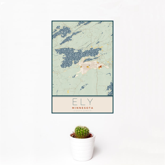 12x18 Ely Minnesota Map Print Portrait Orientation in Woodblock Style With Small Cactus Plant in White Planter
