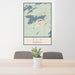 24x36 Ely Minnesota Map Print Portrait Orientation in Woodblock Style Behind 2 Chairs Table and Potted Plant