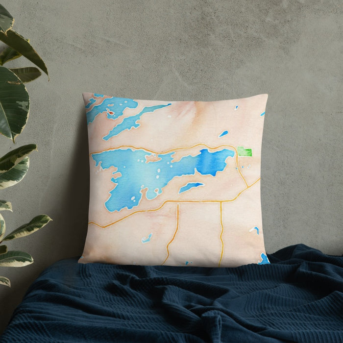 Custom Ely Minnesota Map Throw Pillow in Watercolor on Bedding Against Wall
