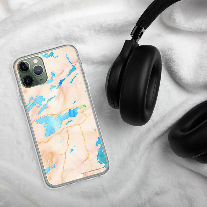 Custom Ely Minnesota Map Phone Case in Watercolor on Table with Black Headphones