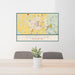 24x36 Enumclaw Washington Map Print Lanscape Orientation in Woodblock Style Behind 2 Chairs Table and Potted Plant