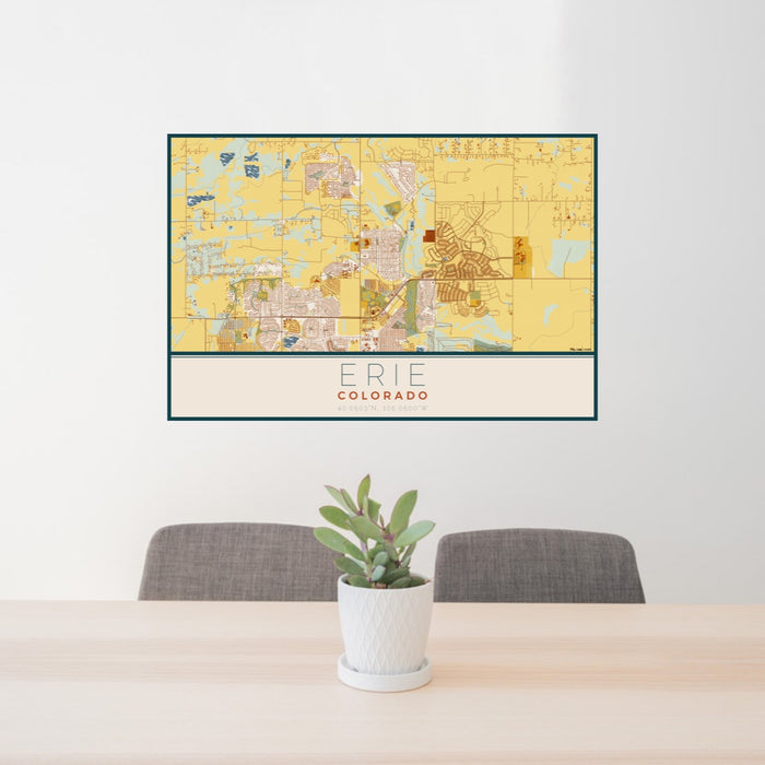 24x36 Erie Colorado Map Print Lanscape Orientation in Woodblock Style Behind 2 Chairs Table and Potted Plant