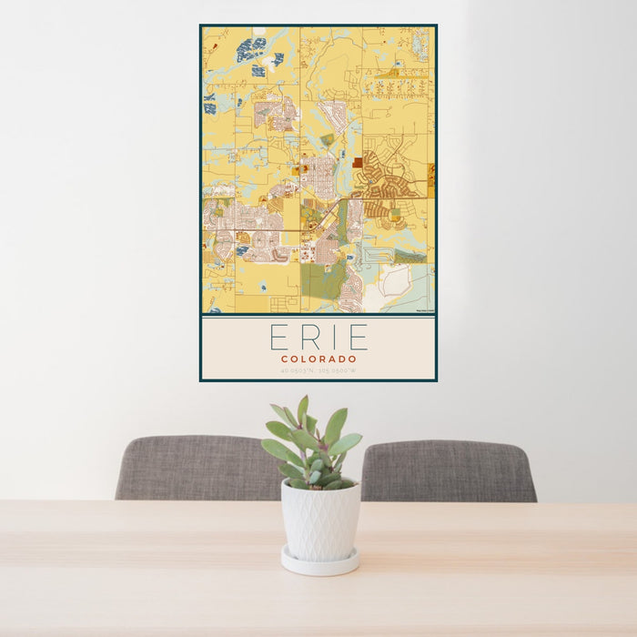 24x36 Erie Colorado Map Print Portrait Orientation in Woodblock Style Behind 2 Chairs Table and Potted Plant