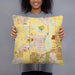 Person holding 18x18 Custom Erie Colorado Map Throw Pillow in Woodblock