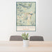 24x36 Estes Park Colorado Map Print Portrait Orientation in Woodblock Style Behind 2 Chairs Table and Potted Plant