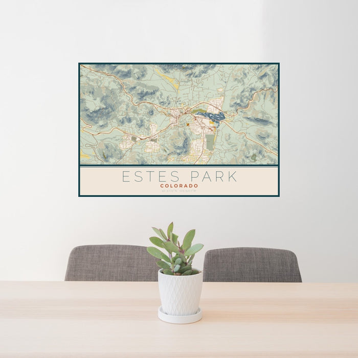 24x36 Estes Park Colorado Map Print Landscape Orientation in Woodblock Style Behind 2 Chairs Table and Potted Plant