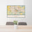 24x36 Eugene Oregon Map Print Landscape Orientation in Woodblock Style Behind 2 Chairs Table and Potted Plant