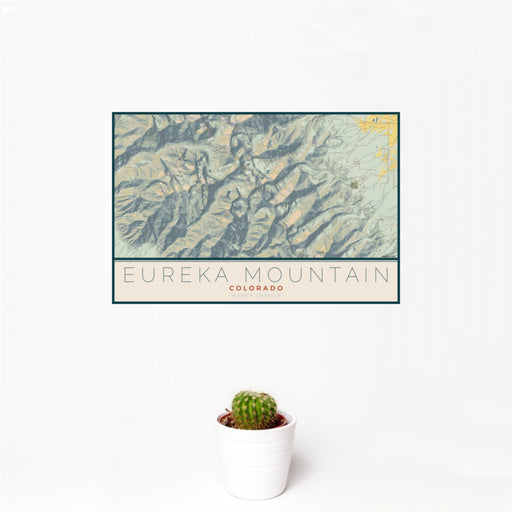 12x18 Eureka Mountain Colorado Map Print Landscape Orientation in Woodblock Style With Small Cactus Plant in White Planter