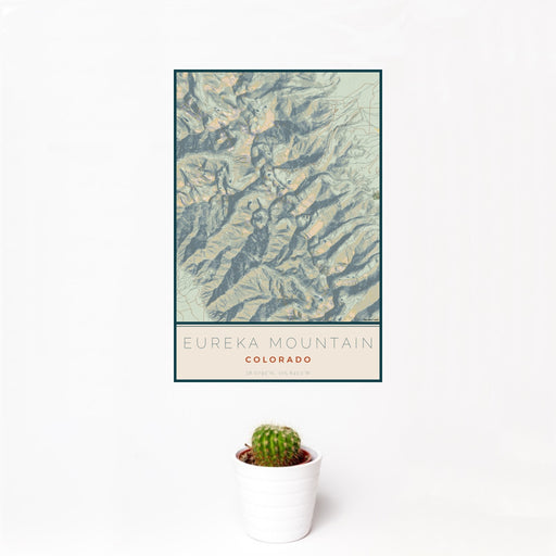 12x18 Eureka Mountain Colorado Map Print Portrait Orientation in Woodblock Style With Small Cactus Plant in White Planter