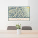 24x36 Eureka Mountain Colorado Map Print Lanscape Orientation in Woodblock Style Behind 2 Chairs Table and Potted Plant