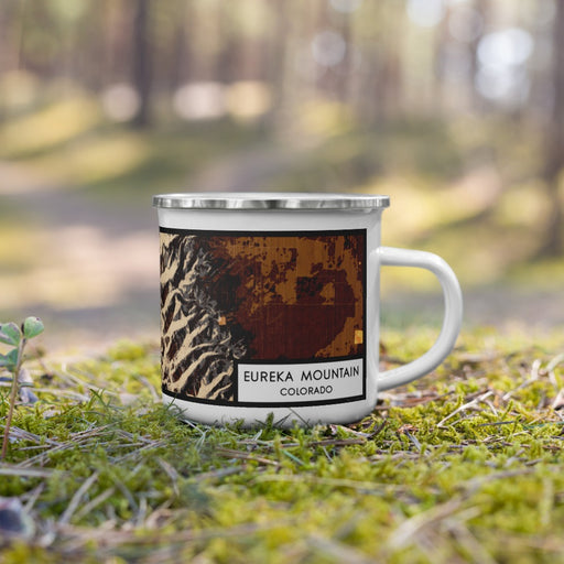Right View Custom Eureka Mountain Colorado Map Enamel Mug in Ember on Grass With Trees in Background