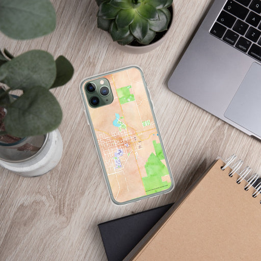 Custom Evansville Wisconsin Map Phone Case in Watercolor on Table with Laptop and Plant