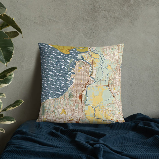 Custom Everett Washington Map Throw Pillow in Woodblock on Bedding Against Wall