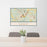 24x36 Exeter New Hampshire Map Print Lanscape Orientation in Woodblock Style Behind 2 Chairs Table and Potted Plant