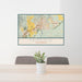 24x36 Fairfield California Map Print Lanscape Orientation in Woodblock Style Behind 2 Chairs Table and Potted Plant