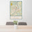 24x36 Fairmont West Virginia Map Print Portrait Orientation in Woodblock Style Behind 2 Chairs Table and Potted Plant