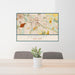 24x36 Fairport New York Map Print Lanscape Orientation in Woodblock Style Behind 2 Chairs Table and Potted Plant