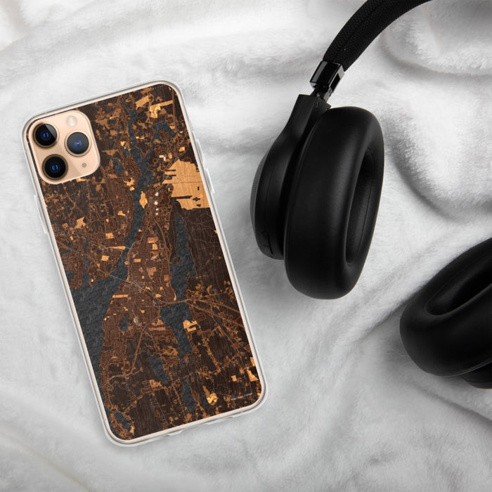Custom Fall River Massachusetts Map Phone Case in Ember on Table with Black Headphones