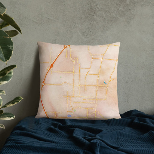 Custom Fayetteville Arkansas Map Throw Pillow in Watercolor on Bedding Against Wall