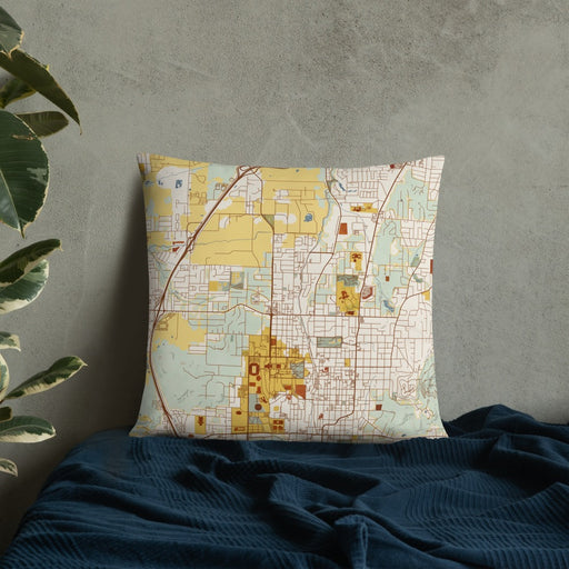 Custom Fayetteville Arkansas Map Throw Pillow in Woodblock on Bedding Against Wall