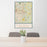 24x36 Fayetteville North Carolina Map Print Portrait Orientation in Woodblock Style Behind 2 Chairs Table and Potted Plant