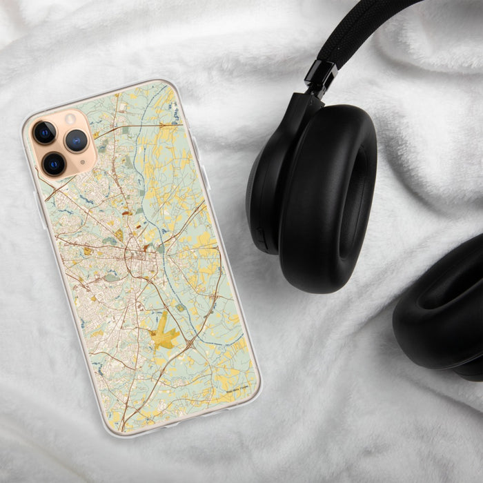 Custom Fayetteville North Carolina Map Phone Case in Woodblock on Table with Black Headphones