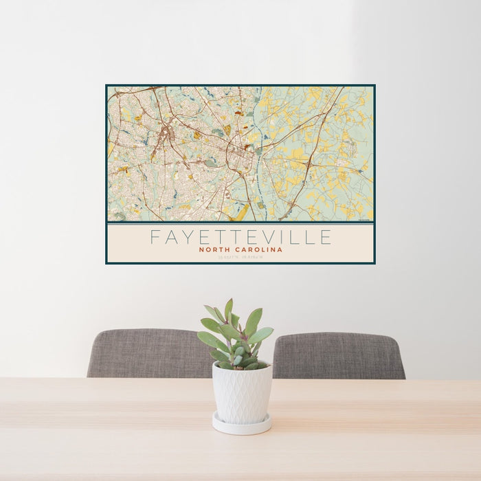 24x36 Fayetteville North Carolina Map Print Landscape Orientation in Woodblock Style Behind 2 Chairs Table and Potted Plant