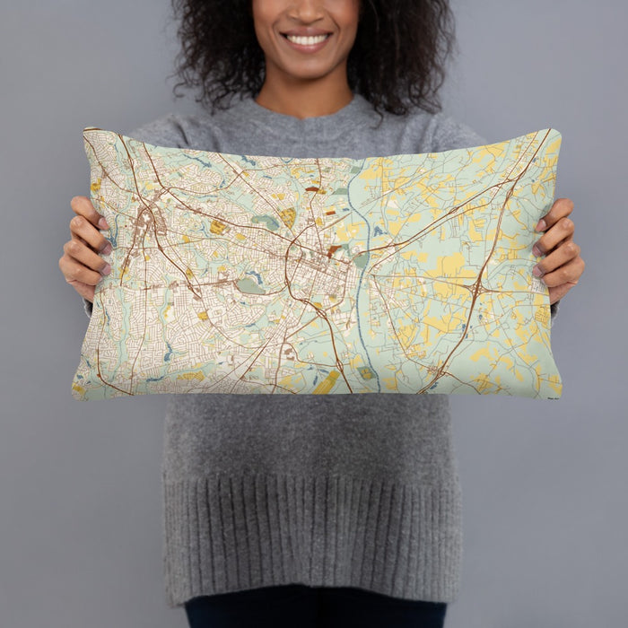 Person holding 20x12 Custom Fayetteville North Carolina Map Throw Pillow in Woodblock