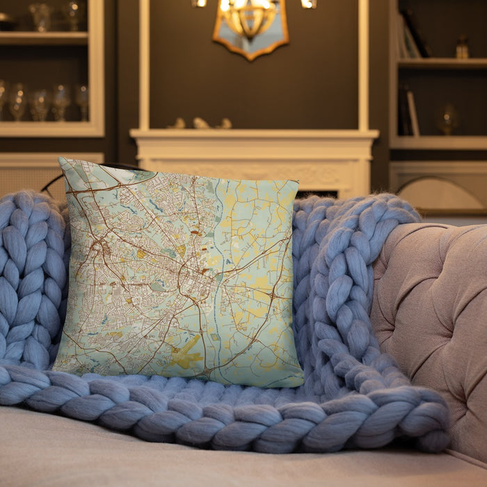 Custom Fayetteville North Carolina Map Throw Pillow in Woodblock on Cream Colored Couch