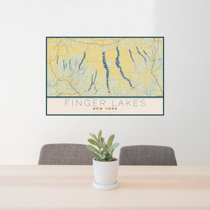 24x36 Finger Lakes New York Map Print Lanscape Orientation in Woodblock Style Behind 2 Chairs Table and Potted Plant