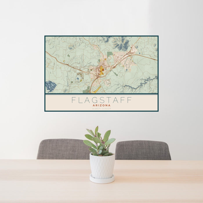 24x36 Flagstaff Arizona Map Print Landscape Orientation in Woodblock Style Behind 2 Chairs Table and Potted Plant