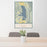 24x36 Flathead Lake Montana Map Print Portrait Orientation in Woodblock Style Behind 2 Chairs Table and Potted Plant