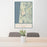 24x36 Florence Oregon Map Print Portrait Orientation in Woodblock Style Behind 2 Chairs Table and Potted Plant