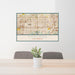 24x36 Fontana California Map Print Lanscape Orientation in Woodblock Style Behind 2 Chairs Table and Potted Plant