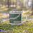 Right View Custom Fort Madison Iowa Map Enamel Mug in Afternoon on Grass With Trees in Background
