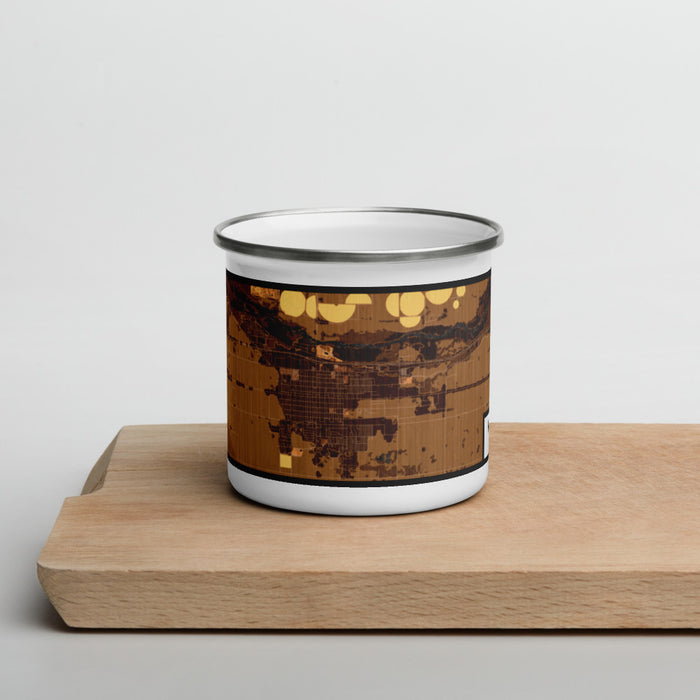 Front View Custom Fort Morgan Colorado Map Enamel Mug in Ember on Cutting Board