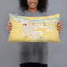 Person holding 20x12 Custom Fort Morgan Colorado Map Throw Pillow in Woodblock