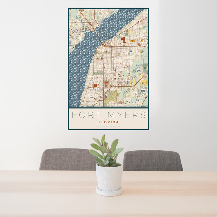 24x36 Fort Myers Florida Map Print Portrait Orientation in Woodblock Style Behind 2 Chairs Table and Potted Plant