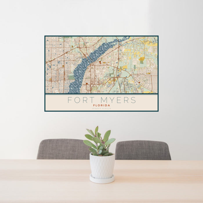 24x36 Fort Myers Florida Map Print Landscape Orientation in Woodblock Style Behind 2 Chairs Table and Potted Plant