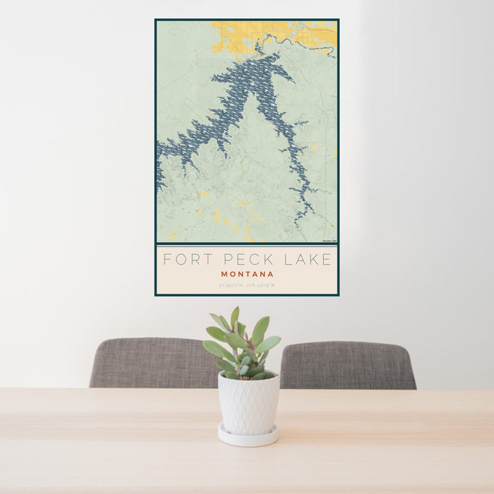 24x36 Fort Peck Lake Montana Map Print Portrait Orientation in Woodblock Style Behind 2 Chairs Table and Potted Plant