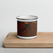 Front View Custom Fort Peck Lake Montana Map Enamel Mug in Ember on Cutting Board