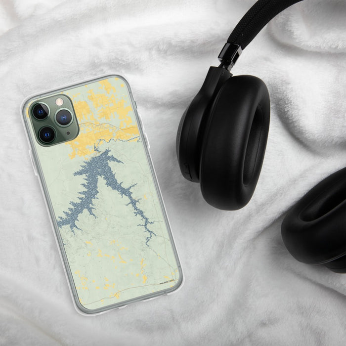 Custom Fort Peck Lake Montana Map Phone Case in Woodblock on Table with Black Headphones