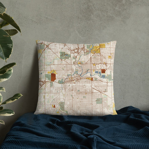 Custom Fort Wayne Indiana Map Throw Pillow in Woodblock on Bedding Against Wall